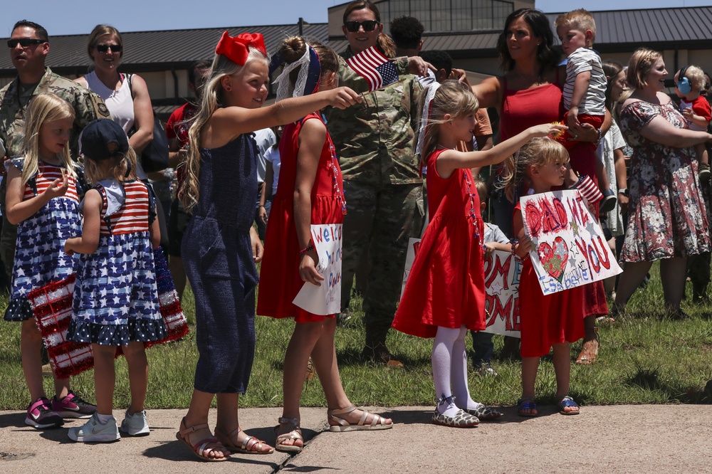 Families and Airmen welcome home 317th Airlift Wing members