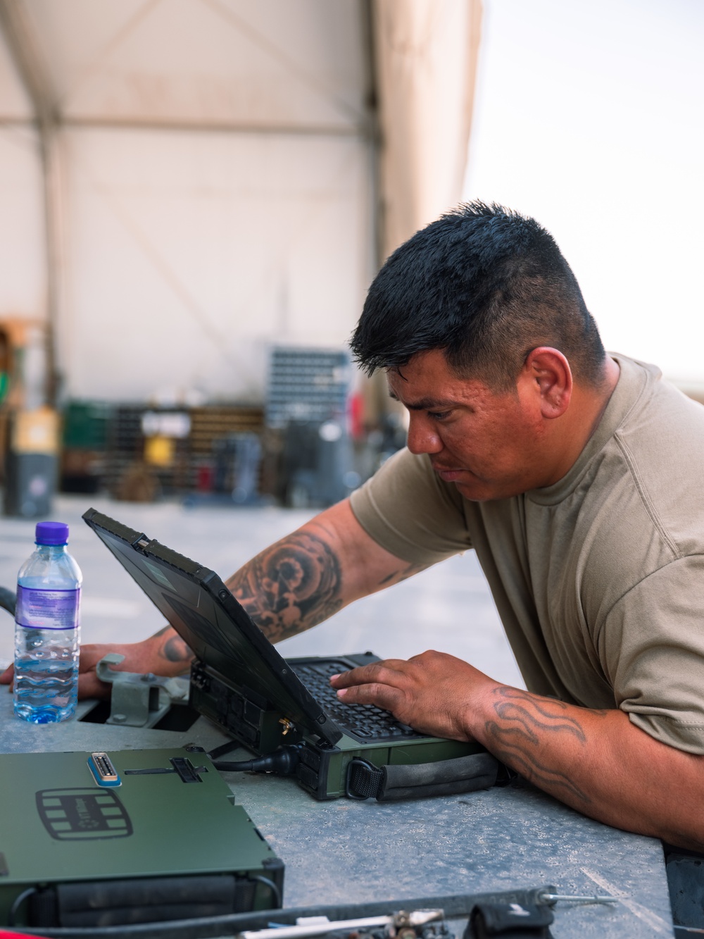 Task Force Phoenix mechanics from the 640th ASB at work