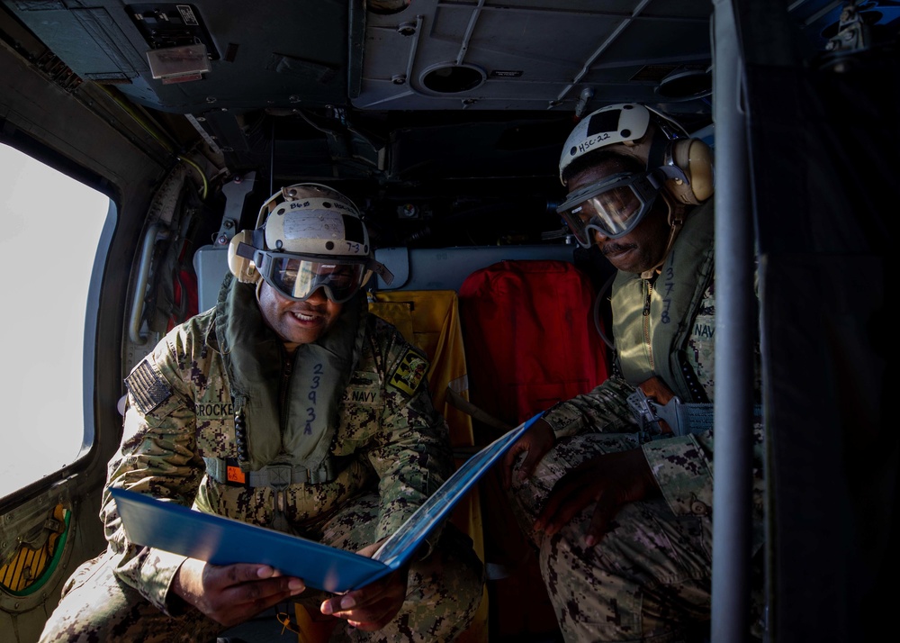 USS Sioux City Sailor Reenlists in Helicopter