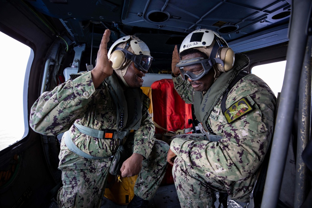 USS Sioux City Sailor Reenlists in Helicopter