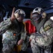 USS Sioux City Sailor Reenlists in Helicopter