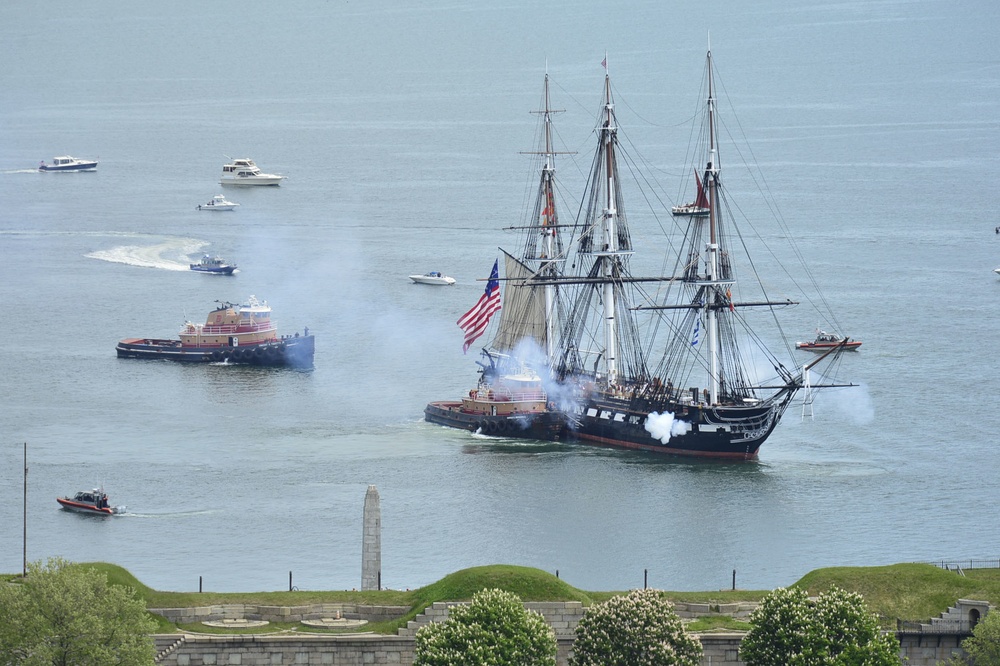 USS Constitution is tugged through the Boston harbor