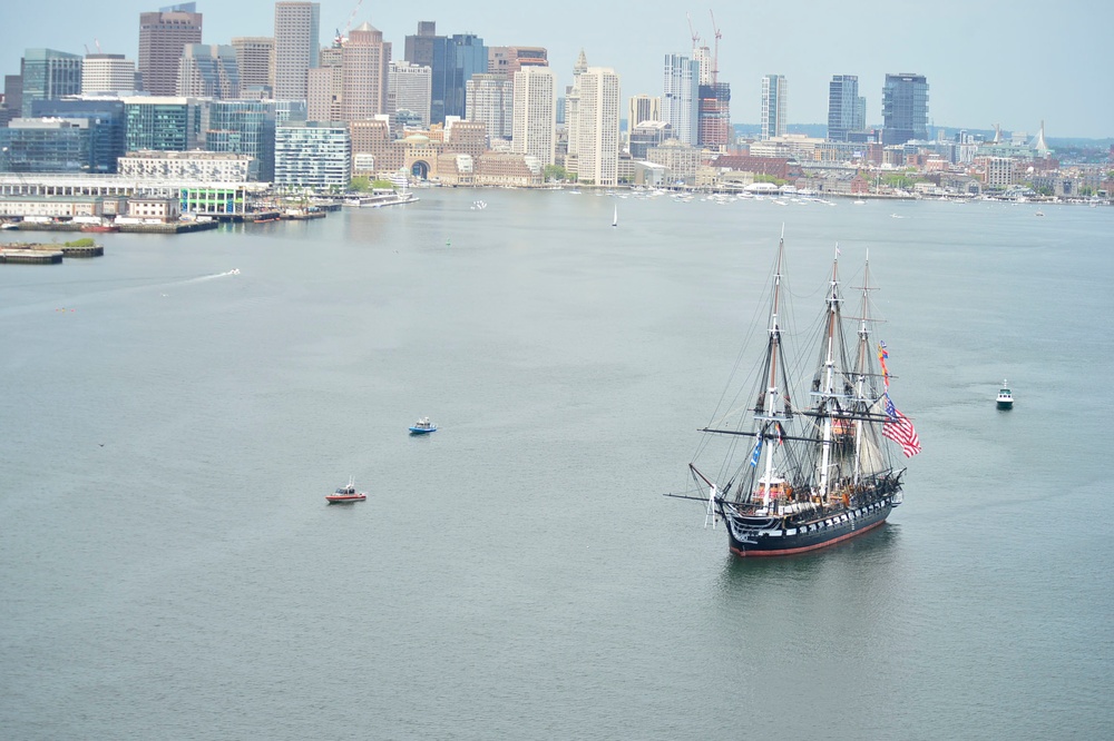 USS Constitution is tugged through the Boston harbor