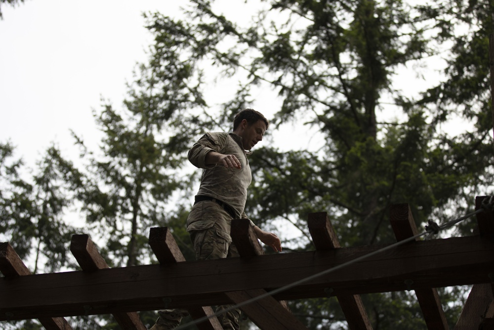 1st Special Forces Group Soldiers compete for Best Warrior Honors at an Obstacle Course