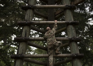 1st Special Forces Group Soldiers compete for Best Warrior Honors at an Obstacle Course