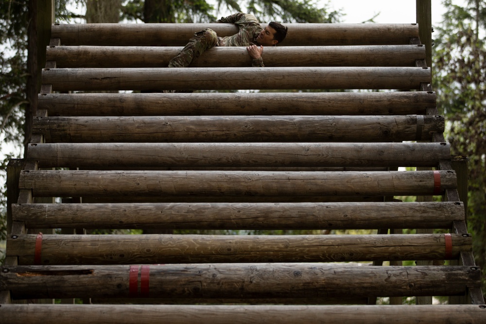 1st Special Forces Group Soldiers compete for Best Warrior Honors at an Obstacle Course