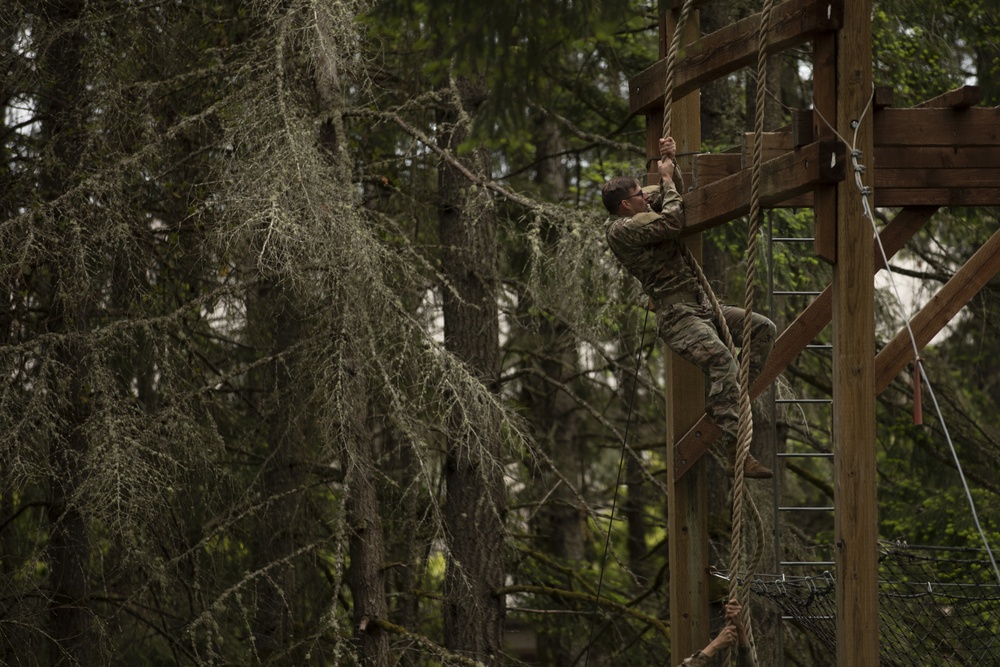 1st Special Forces Group Soldiers compete for Best Warrior Honors at an Obstacle Course