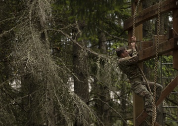 1st Special Forces Group Soldiers compete for Best Warrior Honors at an Obstacle Course