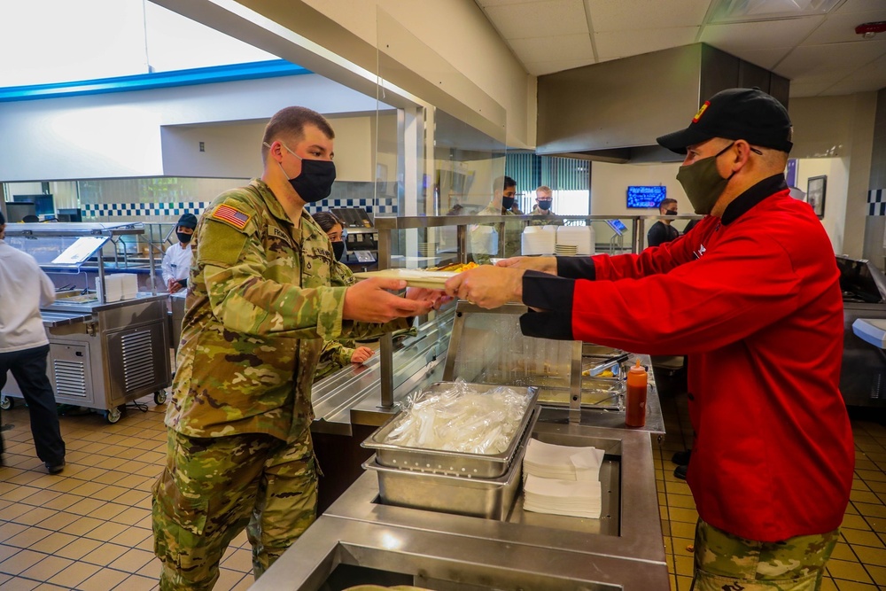 Born steps into the kitchen, serves Soldiers' breakfast