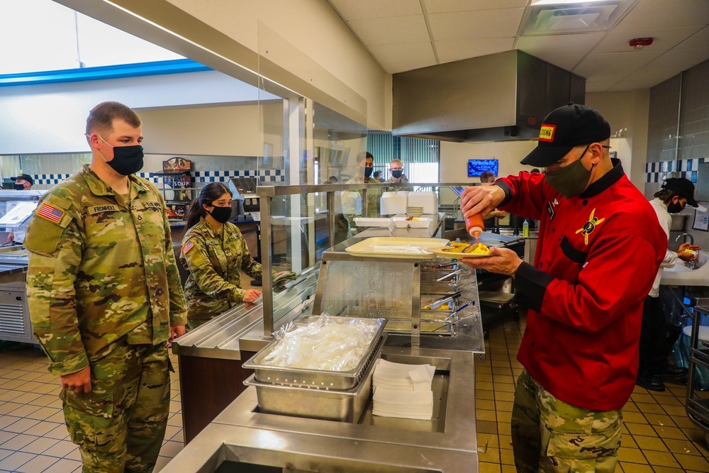 Born steps into the kitchen, serves Soldiers' breakfast