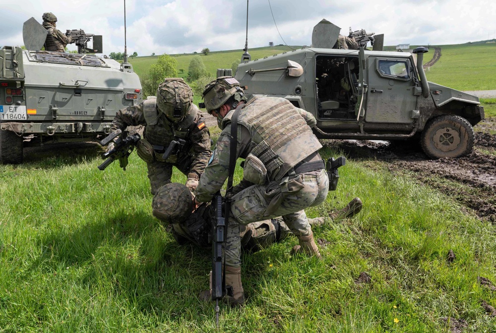 Spanish Soldiers assigned to the VII Brigade BRILAT recover a simulated casualty during Exercise Steadfast Defender 2021 in Romania. More than 270 Spanish troops deployed to Romania in support of the exercise