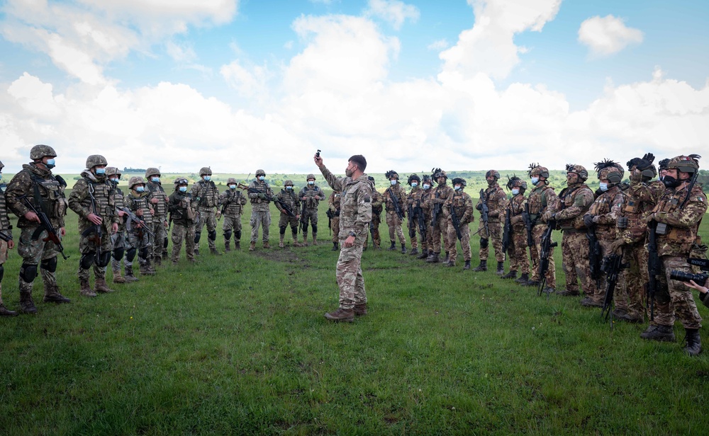 Corporal Sebastian Drakeford, assigned to Allied Joint Force Command Naples, films Italian, Spanish and Romanian Soldiers during Exercise Steadfast Defender 2021 in Romania