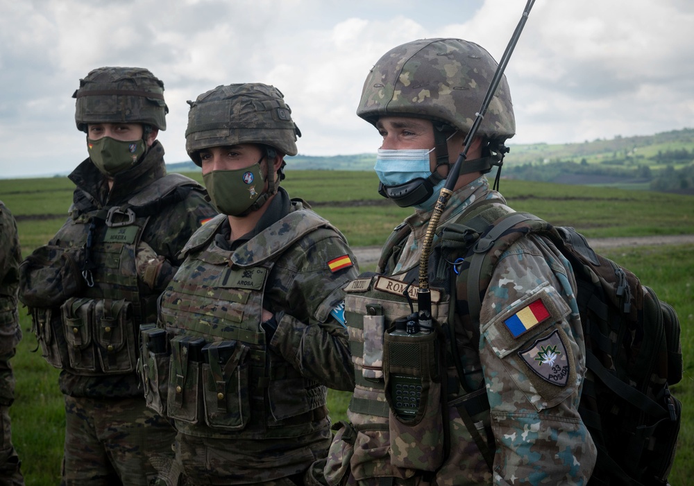 Spanish and Romanian Soldiers are briefed tactics while conducting reconnaissance training during Exercise Steadfast Defender 2021 in Romania.