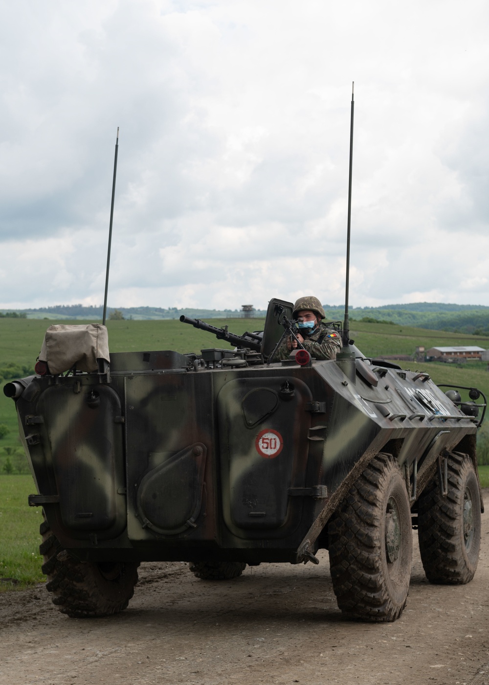 A Romanian Soldier mans a gun mount while conducting reconnaissance training during Exercise Steadfast Defender 2021 in Romania