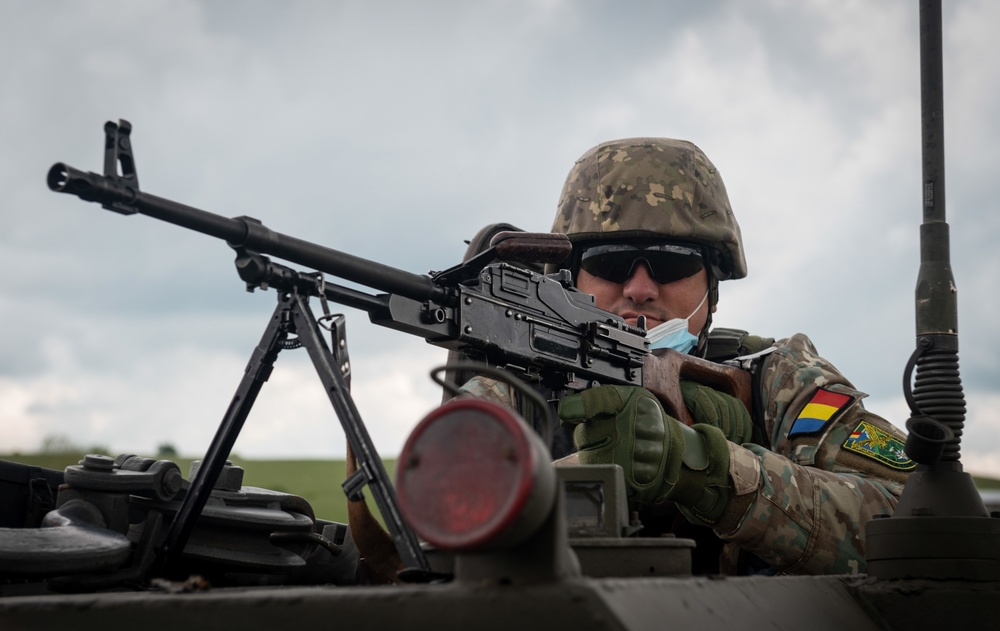 A Romanian Soldier poses for a photo while conducting reconnaissance training during Exercise Steadfast Defender 2021 in Romania