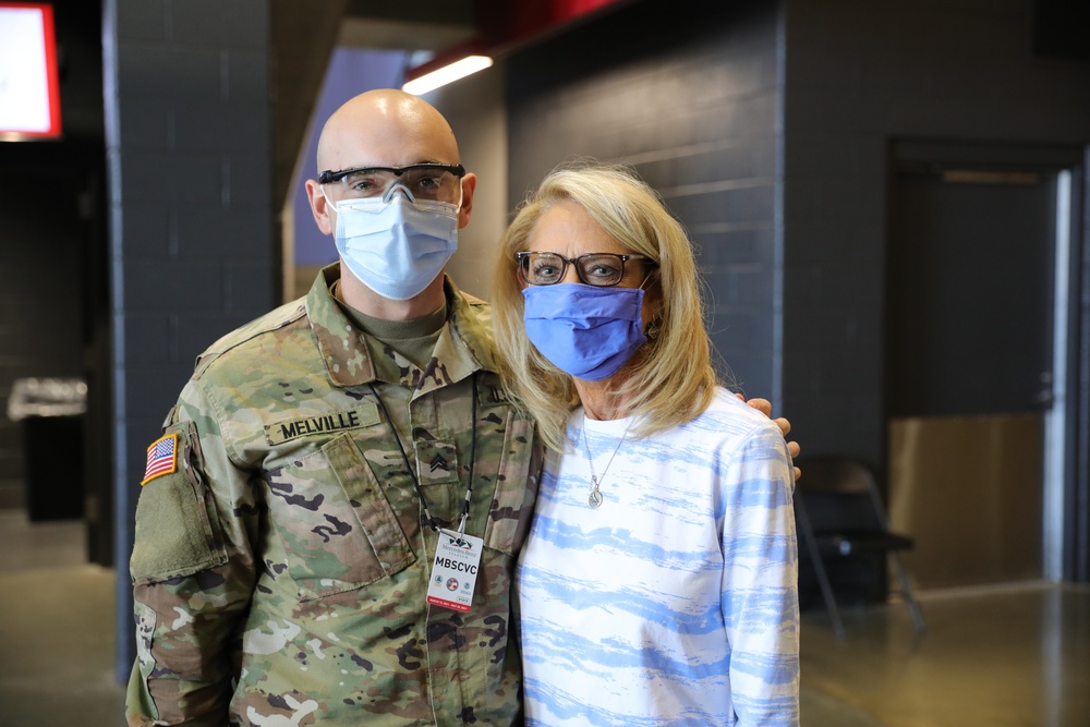 Caring full circle; U.S. Army Soldier vaccinates mom