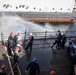 Sailors Discharge Participate in Fire Drill
