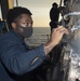 Sailors Aboard USS Milius (DDG 69) Paint Bulkhead