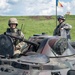 Romanian Soldiers from the Carpathian Eagles Battalion operate an armoured vehicle