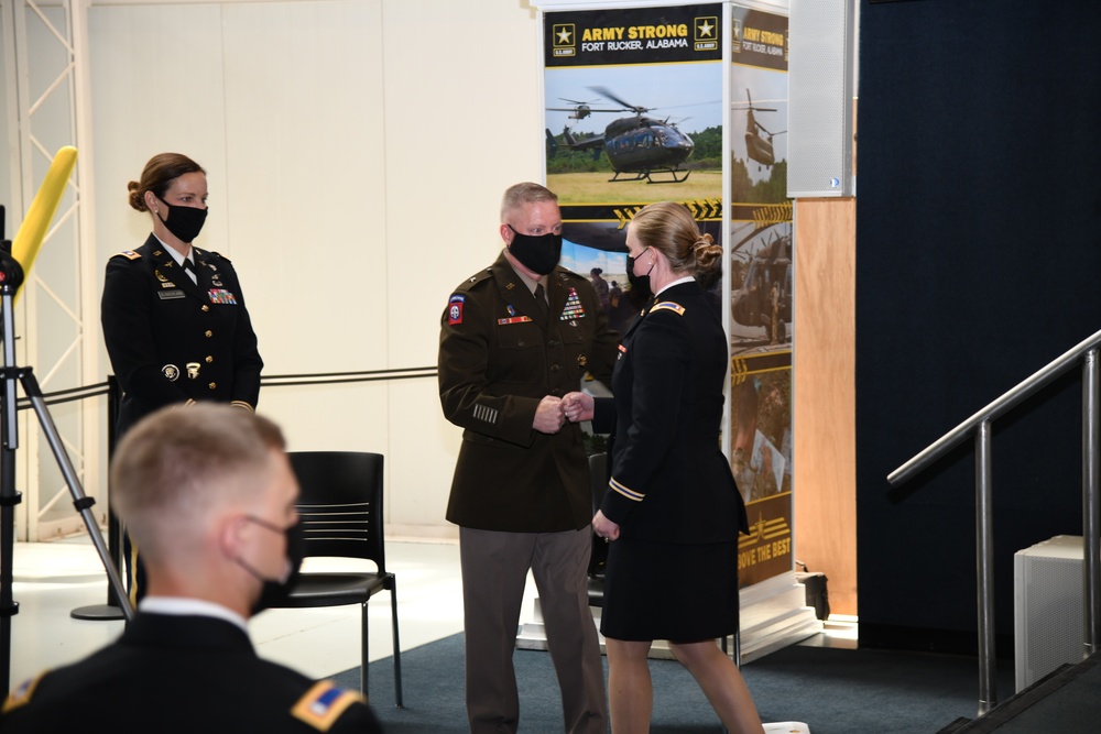 BG McCurry congratulates 1LT Delvaux as she graduates flight school