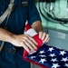 USS Sioux City Sailor Folds Ensign While the Ship is In-port