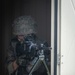 A Spanish Soldier assigned to the BRILAT Brigade holds his position from a window while conducting urban combat training during Exercise Steadfast Defender 2021