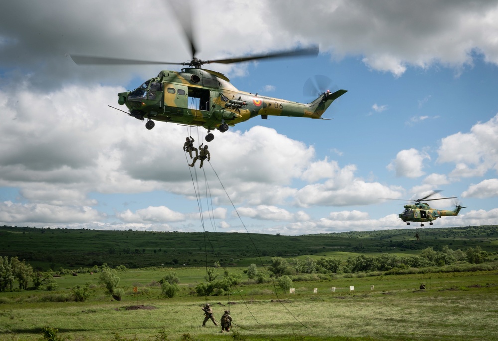Romanian IAR 330 helicopters transport special forces troops during Exercise Steadfast Defender 2021