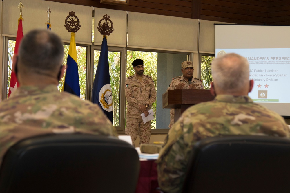 Kuwait Naval Forces and Task Force Spartan service members gather for legal symposium