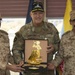 Task Force Spartan Commanding General and Kuwait Army Legal Officers exchange gifts after legal symposium