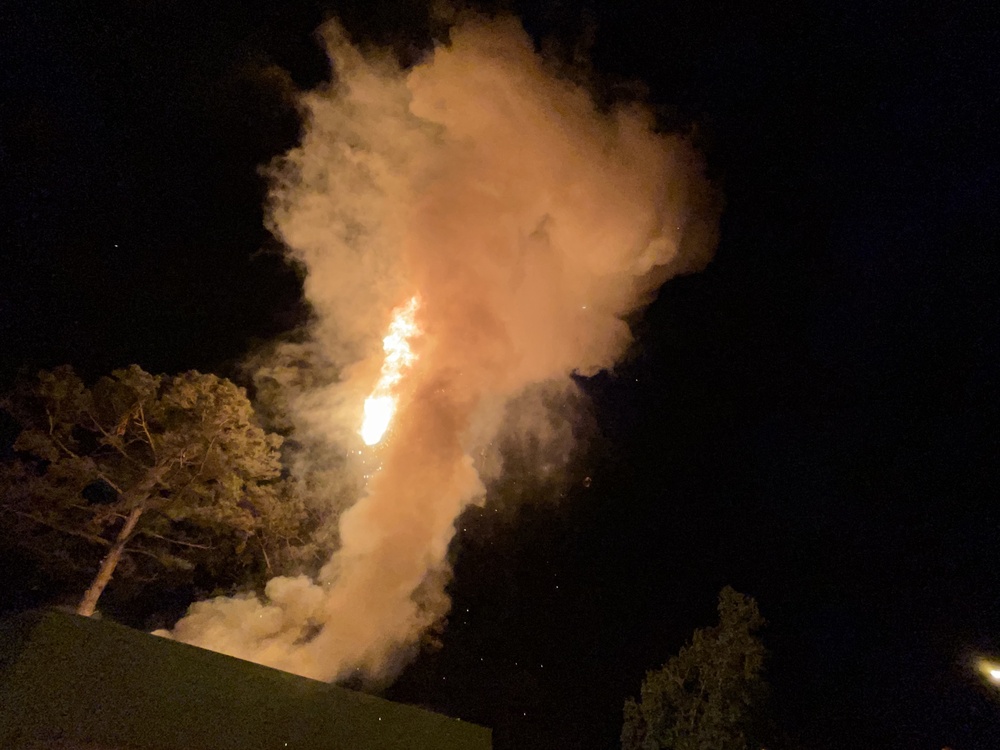 Explosion with cloud and flames during night operations at the Army's Joint Readiness Training Center Rotational Training