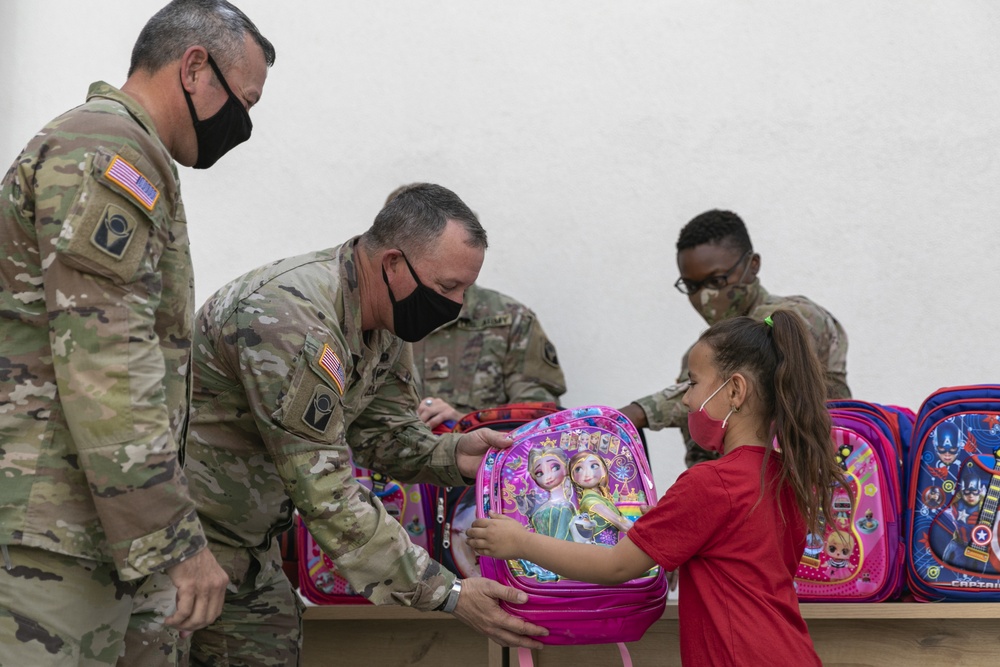 53rd IBCT command team handout school supplies in Bathore Village Albania