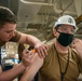 administers the COVID-19 vaccine