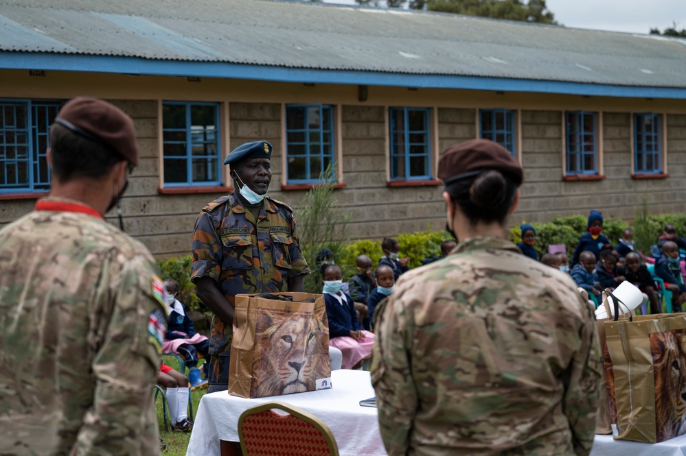 USAF Combat Aviation Advisors present school supplies to Moi Air Base students