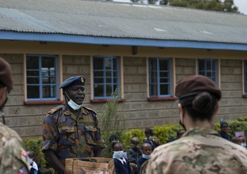 USAF Combat Aviation Advisors present school supplies to Moi Air Base students