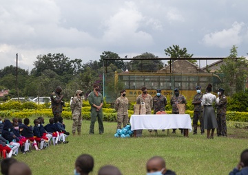 USAF Combat Aviation Advisors present school supplies to Moi Air Base students