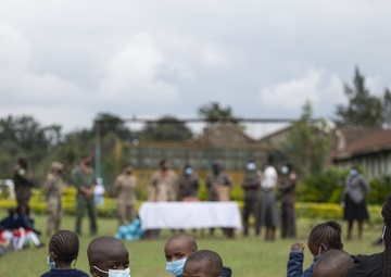USAF Combat Aviation Advisors present school supplies to Moi Air Base students