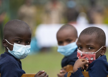 USAF Combat Aviation Advisors present school supplies to Moi Air Base students
