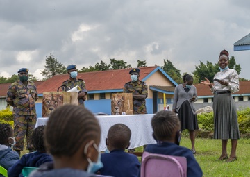 USAF Combat Aviation Advisors present school supplies to Moi Air Base students