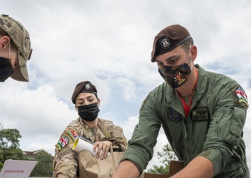 USAF Combat Aviation Advisors present school supplies to Moi Air Base students