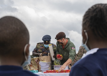 USAF Combat Aviation Advisors present school supplies to Moi Air Base students