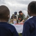 USAF Combat Aviation Advisors present school supplies to Moi Air Base students