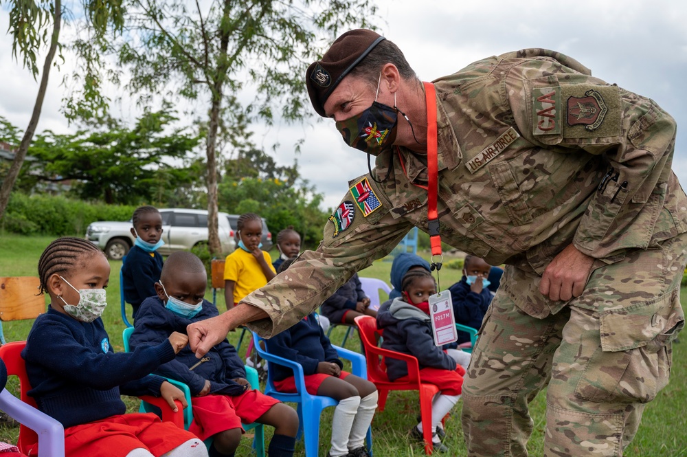 USAF Combat Aviation Advisors present school supplies to Moi Air Base students