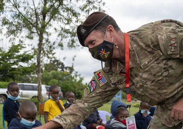 USAF Combat Aviation Advisors present school supplies to Moi Air Base students