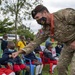 USAF Combat Aviation Advisors present school supplies to Moi Air Base students
