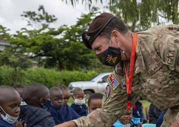 USAF Combat Aviation Advisors present school supplies to Moi Air Base students