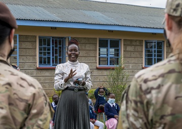 USAF Combat Aviation Advisors present school supplies to Moi Air Base students