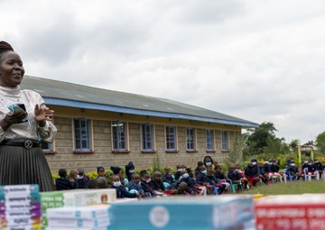 USAF Combat Aviation Advisors present school supplies to Moi Air Base students