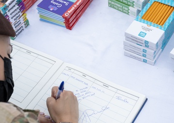 USAF Combat Aviation Advisors present school supplies to Moi Air Base students