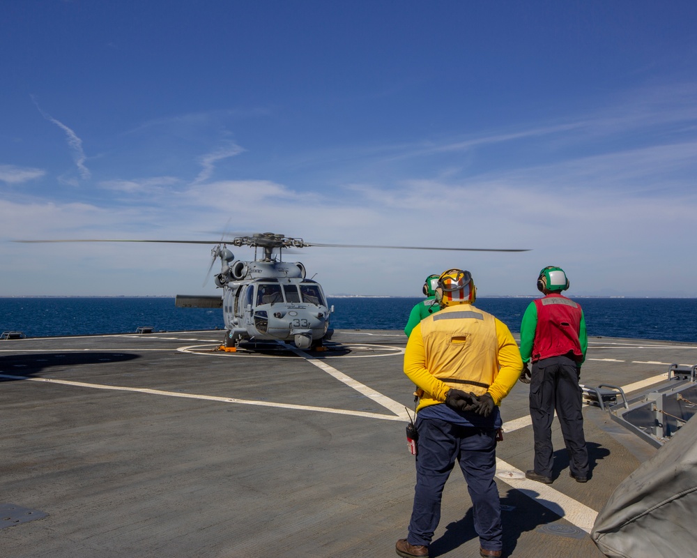 An MH-60 Sea Hawk helicopter attached to the “Dragon Whales” of Helicopter Sea Combat Squadron (HSC) 28 powers down after landing aboard the blue Ridge-class command and control ship USS Mount Whitney (LCC 20) off the coast of Rota, Spain