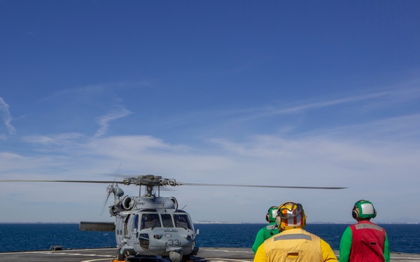 An MH-60 Sea Hawk helicopter attached to the “Dragon Whales” of Helicopter Sea Combat Squadron (HSC) 28 powers down after landing aboard the blue Ridge-class command and control ship USS Mount Whitney (LCC 20) off the coast of Rota, Spain